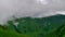 Green Hills and Mountains with Rising Clouds Timelapse. Kavkaz region