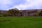 Green hills and an old stone farm house near Black Mountains, Brecon Beacons , Wales, UK