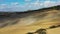 Green hills, olive gardens and small vineyard under rays of morning sun, Italy, Tuscany, San Quirico D`Orcia. Famous Tuscany