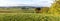 Green hilly landscape with Giant Mountains, Czech: Krkonose, on skyline, Czech Republic.