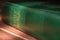 Green Holy Bible in sunlight. Religion and faith concept. Religious literature. Green Bible .