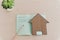 Green home checklist, miniature house on notepad