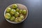 Green homemade apples on table left on dark table