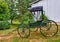 Green horse drawn buggy