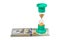 Green hourglass and US dollar banknotes on a white background. Hourglass and US dollar banknotes isolate