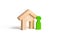 A green human figure stands near the house on an isolated background. concept of selling a home, buying from the owner. Buying