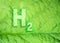 Green hydrogen energy symbol on a leaf texture. Ecological Concept