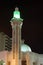 Green illuminated mosque in Abu Dhabi