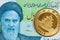 A green Iranian ten thousand rial banknote with a Chinese gold coin close up