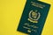 Green Islamic Republic of Pakistan passport on yellow background close up