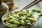 Green Japanese Soybean in wooden bowl on table wood
