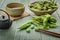 Green Japanese Soybean in wooden bowl on table wood