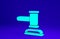 Green Judge gavel icon isolated on blue background. Gavel for adjudication of sentences and bills, court, justice