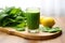 green juice in a stem glass on a wooden chopping board