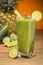 Green juice on wooden board