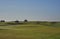 Green Keepers out on their Ride on Lawn Tractors mowing the Fairways and Greens at Carnoustie Golf course.