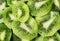 Green kiwi food background, top view