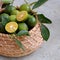 Green Kumquat fruit on wooden background