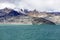 Green lake, snow mountain, white clouds, blue sky