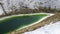 Green lake in white nitrogen waste