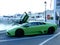 Green Lamborghini with a door opened in Spain