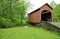 Green landscape with Dents Run Covered bridge