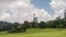 Green landscape with hills and fields in Asia. Peradeniya. Royal Botanic Garden, Sri Lanka.