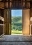 green landscape from inside doorway of rustic barn