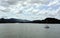 Green landscape of Panama Canal, view from the transiting cargo ship.