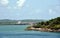 Green landscape of Panama Canal, view from the transiting cargo ship.