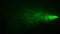 Green Laser Rays Lighting in Smoke on a Dark Background