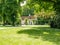 Green lawn and house in Minnewaterpark in Bruges, West Flanders, Belgium