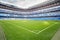 Green lawn with marking at empty outdoor football stadium