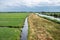 Green lawns and canals at the natural flood zones of the Reeuwijkse plassen in Reeuwijk, The Netherlands