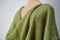 Green layered knitted fabric. spring seasonal clothing.