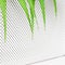 Green leaves of an ornamental palm tree lie on the white grate of a modern air purifier. The concept of an eco-friendly atmosphere