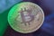 Green light on Bitcoin currency coin extreme close-up