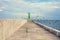 Green lighthouse on a breakwater