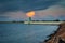 Green lighthouse on the western breakwater in Nowy Port, Gdansk