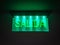 Green lighting exit sign
