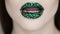 Green lips covered with rhinestones. Beautiful woman with Green lipstick.