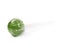 Green lollipop candy isolated