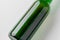 Green longneck beer bottle mockup. Close-up