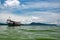 Green Longtail boat moored in Saracen Bay in Koh Ron Samloem, Cambodia