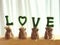 Green love alphabet on the small rattan bags