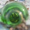 Green malt liquor bottle found littered in the snow around train tracks near the Minnesota Valley National Wildlife Refuge