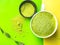 Green matcha tea latte drink and powder on green background. Japanese tea ceremony concept. Copy space