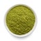 Green matcha tea powder in round bowl isolated on white. Top view