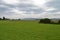 Green Meadow on the banks of Zurich River, Cloudy Sky, Buildings on other bank