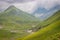 Green meadow landscape high up in the HImalayas. Great Lake Trek in Kashmir. Mountains in Gangabal Lake vicinity